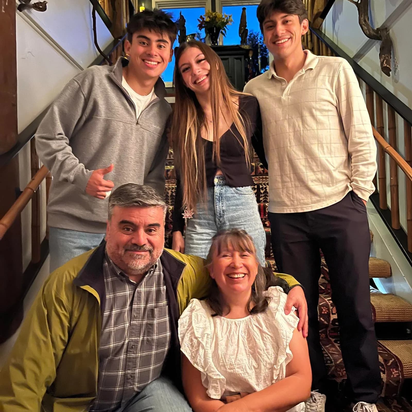 The Garcinuño family on the stairs at home.