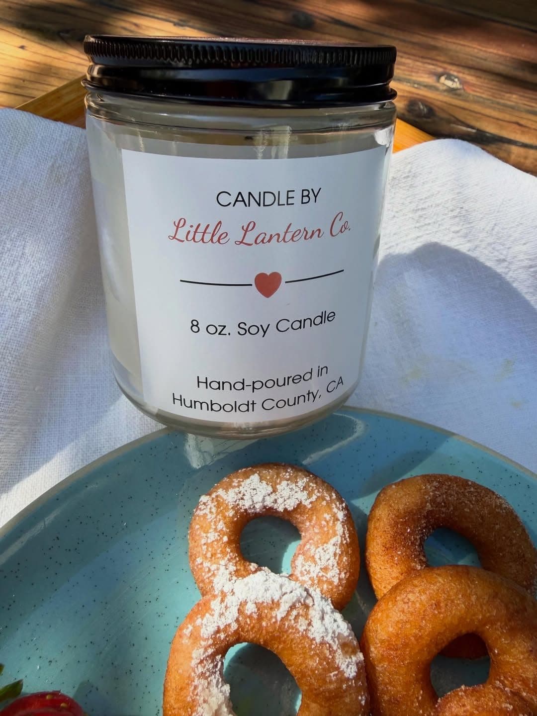 The Sugar Love candle, hand-poured in Humboldt County by Little Lantern Co. from the smell of our donuts.